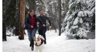 Aubrie Piper, Akira and Charlie Beckers running in the snowy forest